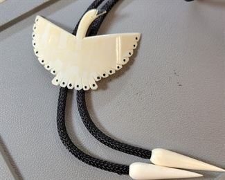 Carved bone bolo tie