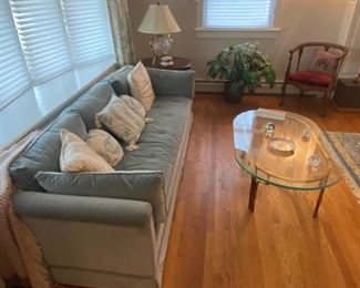 MCM Couch amd glass oval table on brass.