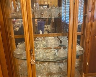 Curved glass oak china display cabinet with A Lot of glassware inside