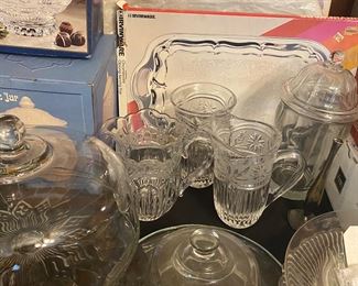 Lots of platters, cake stands, serving pieces, many in original boxes