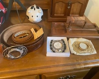 Belt buckles meant to hold silver dollars