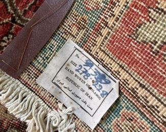 Tag on the Persian Rug