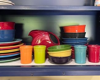 Fiesta ware plates, bowls, pitcher and cups