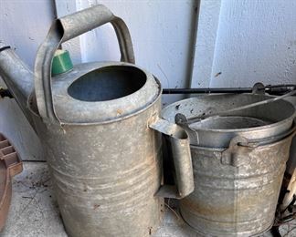 Metal watering can and buckets