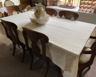 Dining room chairs. The table is teak midcentury and slim lined. Sold separately.