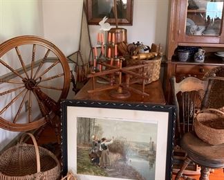 Assorted handmade antique baskets, spinning wheels, winder, early unusual piano/spinet stool with back 