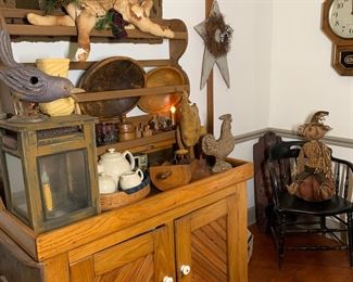 Fine mix of of primitive antiques and Colonial style accessories including a early dry sink, primitive wood bowls, mashers and grain scoops, antique wall clocks and raven black antique bentwood armchair 