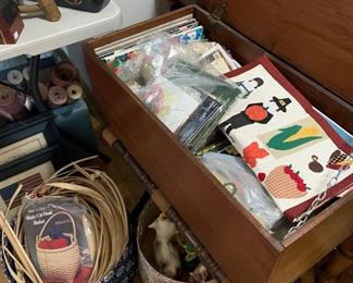 Needlework projects, basketry materials, hook rug kits, oodles of early Americana style fabric in long lengths and pieces, old cutter quilts, coverlets, rag rug materials, vintage cow toys 