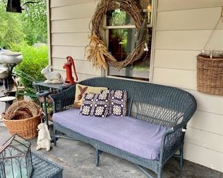 Smoke gray antique wicker settee, antique Peter’s Pump Co. well water pump, concrete garden rabbits 