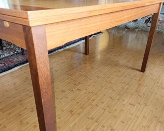 mid century modern dining table, both ends pull out as extension. Slight damage to one spot on top
