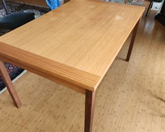mid century modern dining table, both ends pull out as extension. Slight damage to one spot on top
