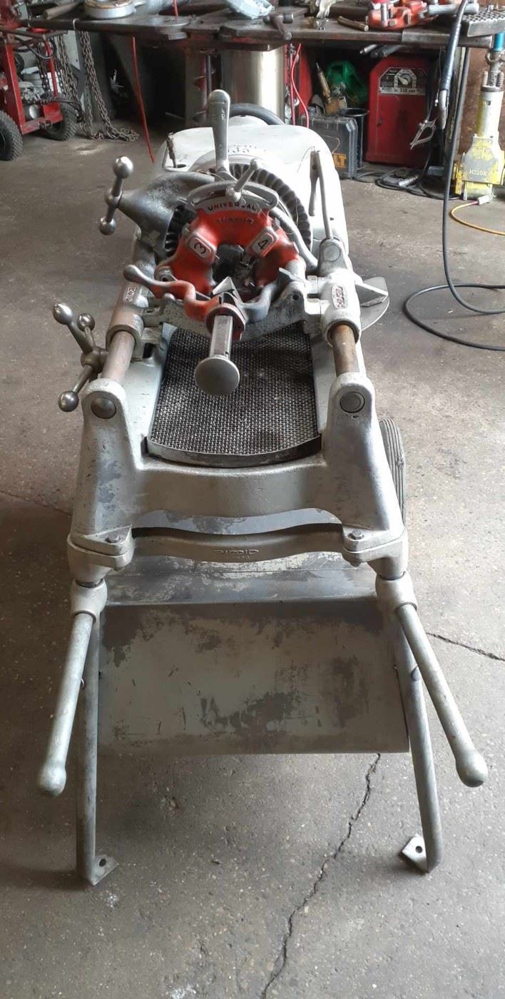 Ridgid 535 Pipe Threader with Cradle, Foot Pedal, Reamer, Pipe Cutter and Adjustable Die.  Not to mention the Cart with the Oiler!