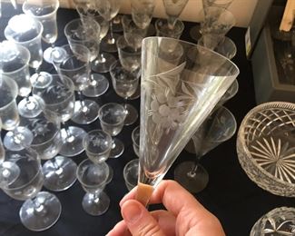 Various sizes of floral etched glassware