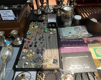 Sterling candle holders, costume jewelry and misc. currency.