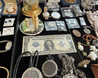 Morgan Silver Dollar necklaces and a 1923 $1 silver certificate.
