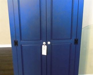 Blue storage/TV cabinet. Stands about 6 feet high.