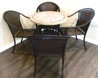 Small dinette table. 4 matching stackable chairs.