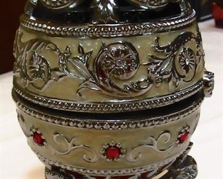 Faberge egg with cross & music box with crystal and jewels by Sankyo. Very collectible. Item sold as shown.