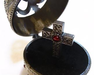 Egg open. Make of some type metal.