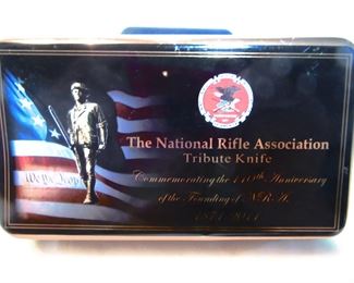 Tin box that holds knife NRA Tribute Knife.