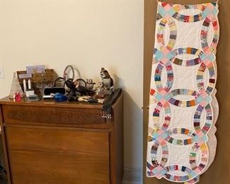 small chest of drawers, hand stitched wedding ring quilt