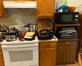 pots and pans, pressure cooker, Oster toaster oven, Oster microwave, toaster, electric knife, microwave stand