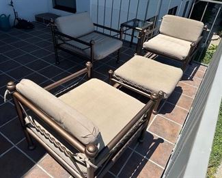 $275 each oversized arm chairs; $175 each ottomans; $175 each tables