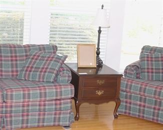 Checked sleeper sofa, end table and matching loveseat.