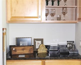 Lots of cds, glassware, frames and vintage fishing rods.