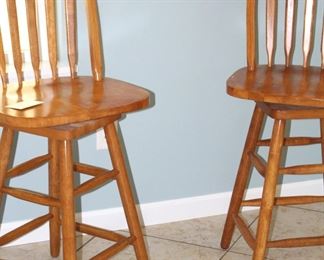 Pair of swivel bar height chairs.