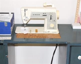Singer sewing machine with cabinet.