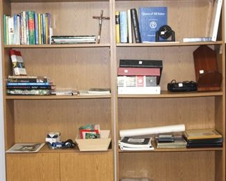 Bookcases, books and other items.