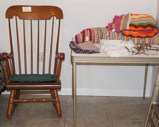 Rocker, card table with four chairs and fun crochet afghans.