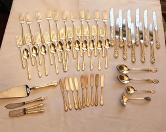Lunt sterling flatware set. Four piece service for eleven plus serving pieces. NOTE: Silver and gold is never left unattended or on property overnight.