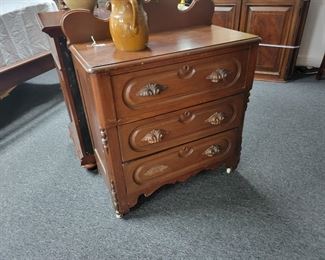 Antique oak 3 drawer chest with carved leaf.  Missing handle is in drawer