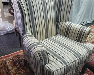 One of a pair of gray stripe wing back chair