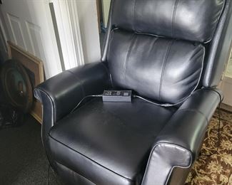 Black leather recliner.  Not only reclines but also raises you to standing position
