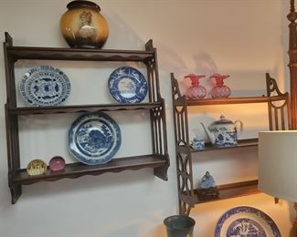 Wall curio slevles.  One with plate rails, one without