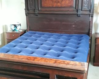 Antique full size bed, circa mid 1800's.  Burled wood insets.  Has matching dresser.