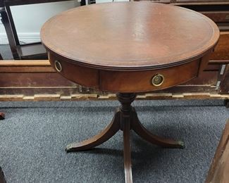 round table with leather inlay