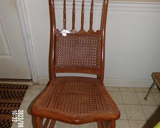 antique cane/straw bottom rocking chair