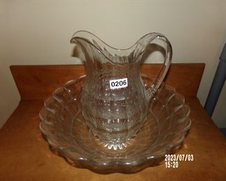 large clear glass basin and pitcher