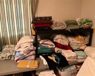 Blankets, sheets, pillow cases, and various types of bedding 