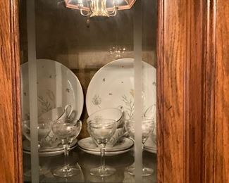 Close up of set of China in China cabinet 