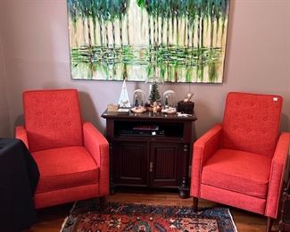 Pair of medium sized orange upholstered recliners.  