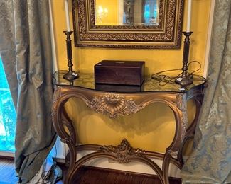 Mirrored gold console table, draperies, lamps, antique box