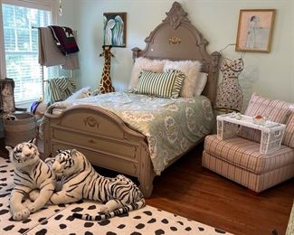 Antique bed, pair of armless chairs, large stuffed animals, 