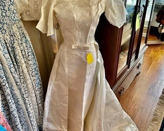 this vintage wedding dress was handmade, it’s very sleek with a removable train that fits around the waist