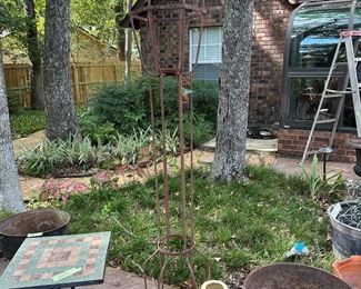 this tall iron piece is decorative and would make a great lantern or light!