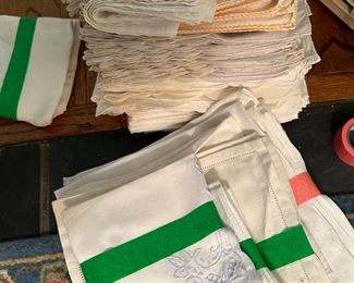 and STACKS of dinner napkins, from damask to embroidered 